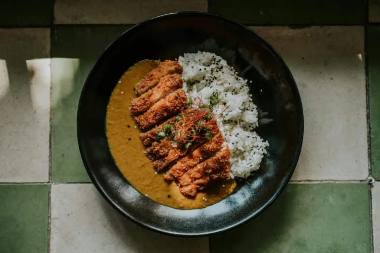 Mouthwatering chicken katsu served with rich curry sauce and white rice.