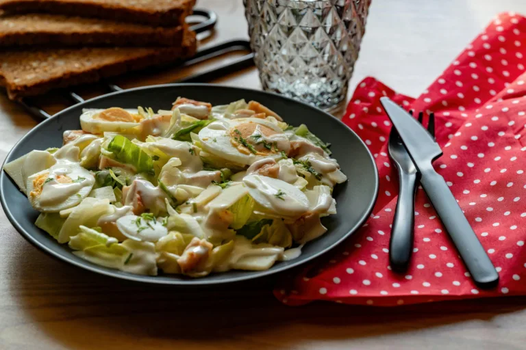A delicious Caesar salad with creamy dressing, perfect for a hearty meal.