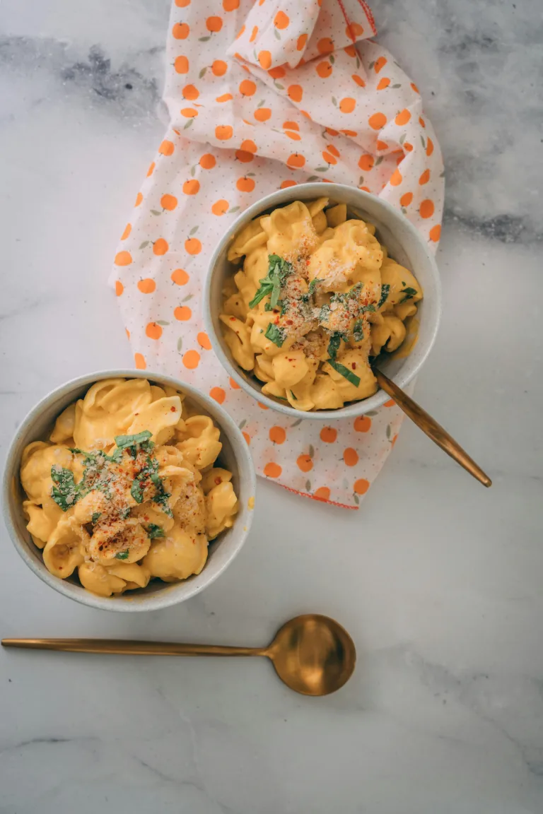 Delicious vegan mac and cheese plated beautifully with elegant presentation.